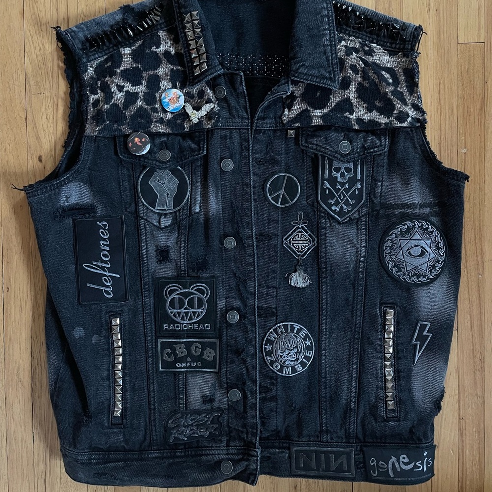 90’s inspired black denim dark battle vest with patches and studs.